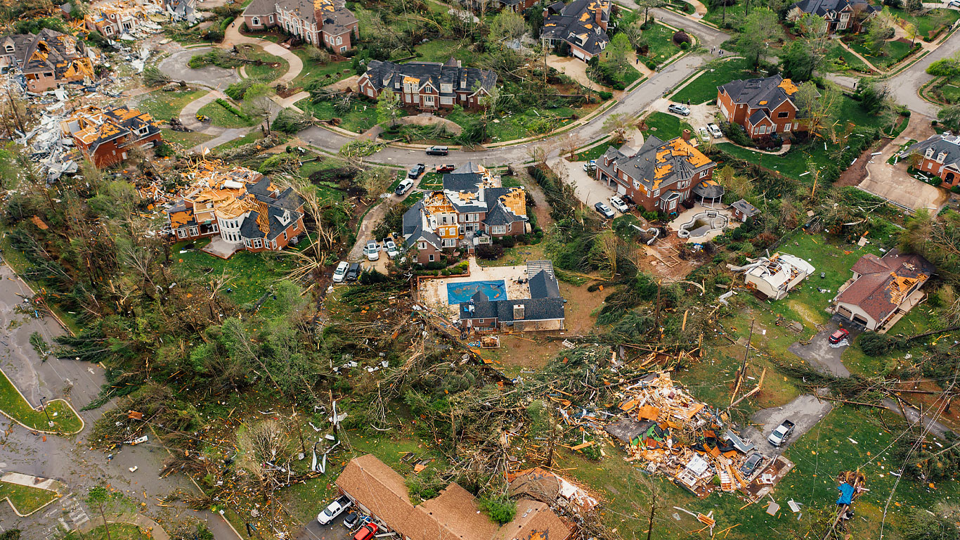 An aerial view of hurricane debris in a residential neighborhood